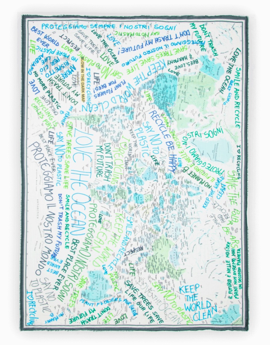 <p>A love of nature is expressed in the rectangular Green Planet scarf. Made of pure cotton, it features the planisphere decorated with messages of environmental&nbsp;sustainability and love for the environment. Finished with a fringed trim, it will make 