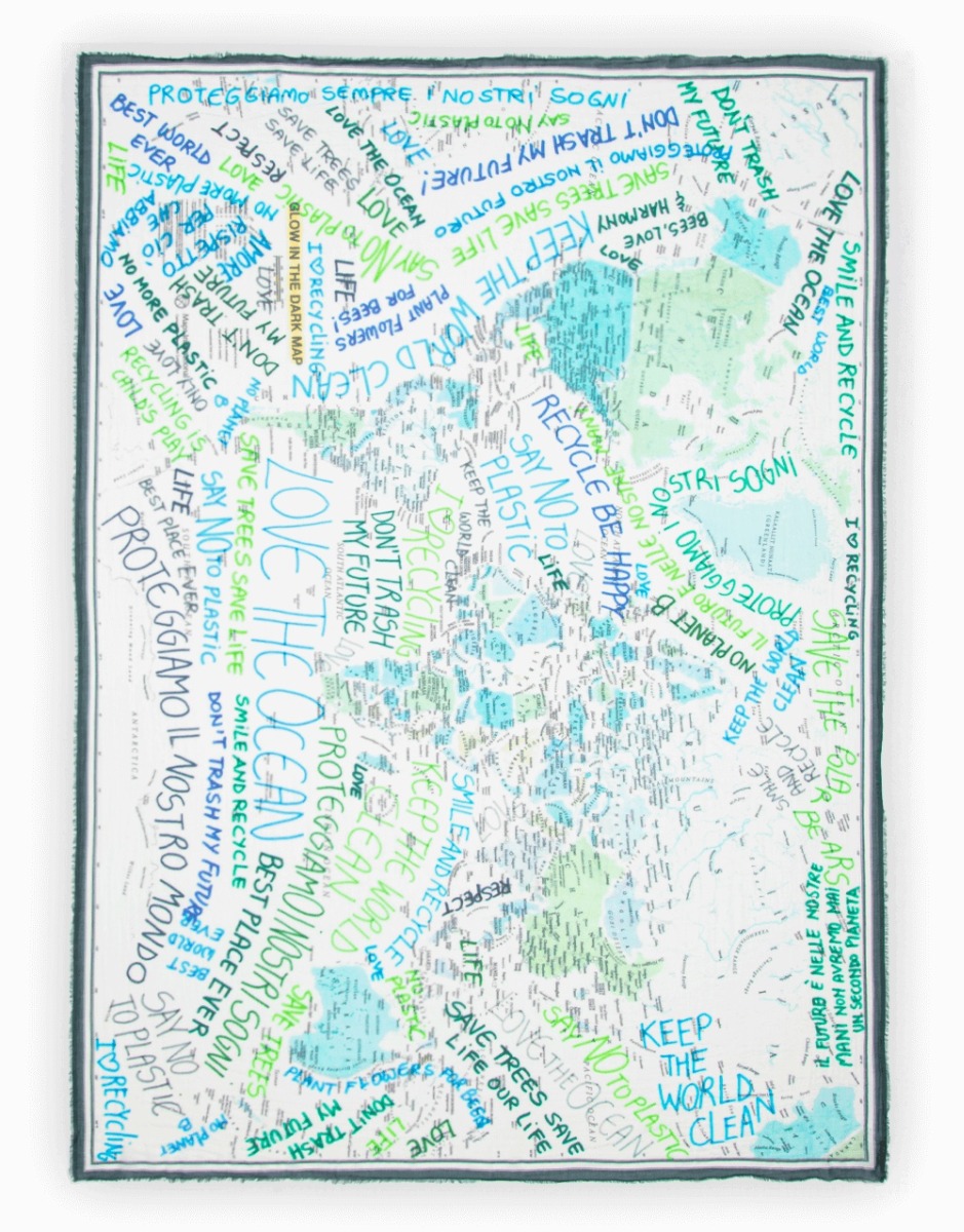 <p>A love of nature is expressed in the rectangular Green Planet scarf. Made of pure cotton, it features the planisphere decorated with messages of environmental sustainability and love for the environment. Finished with a fringed trim, it will make